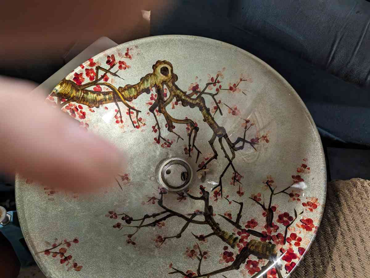 Vanity sink with a rose vine design