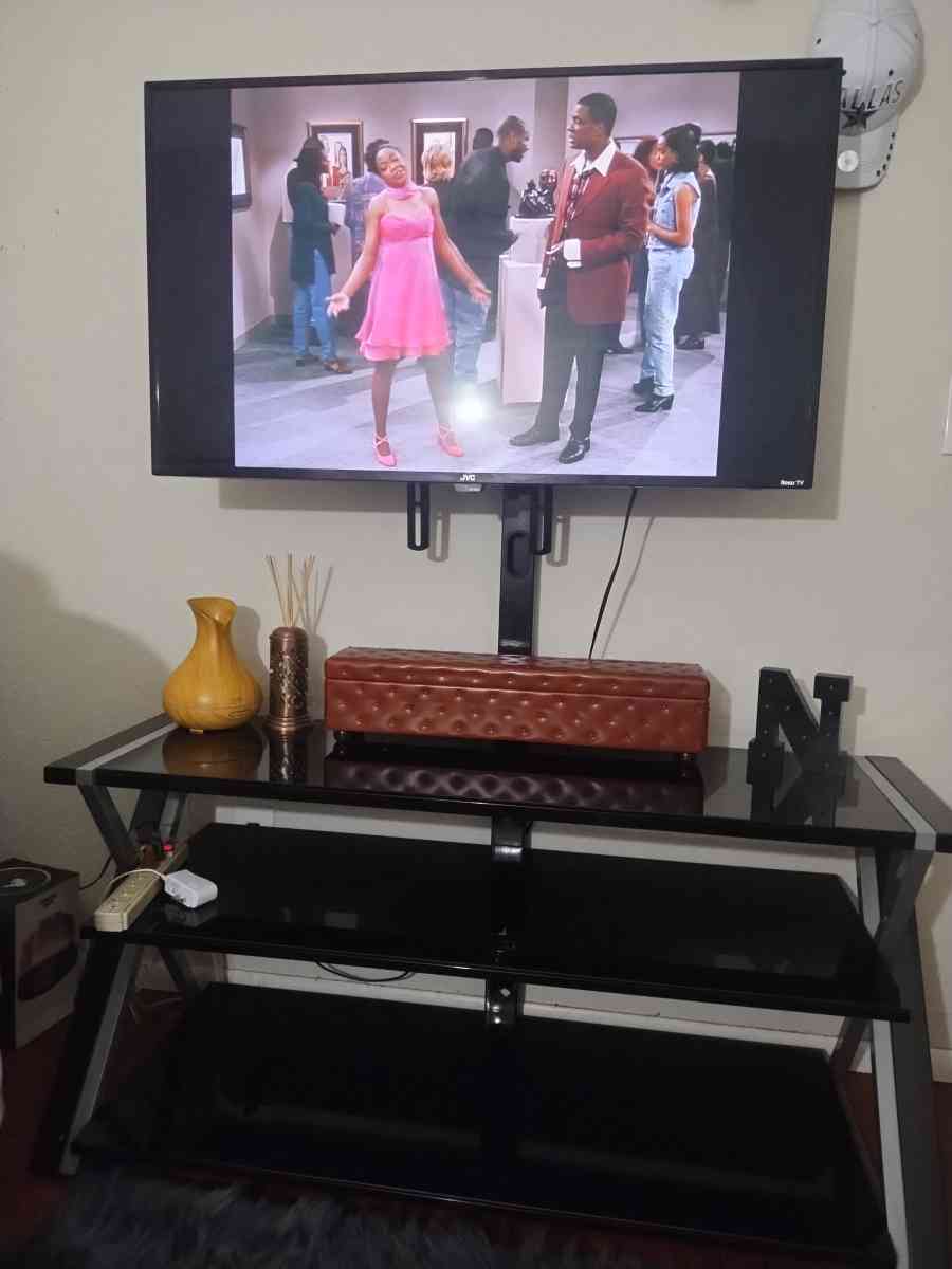 a Roku 45in TV with remote control and TV stand