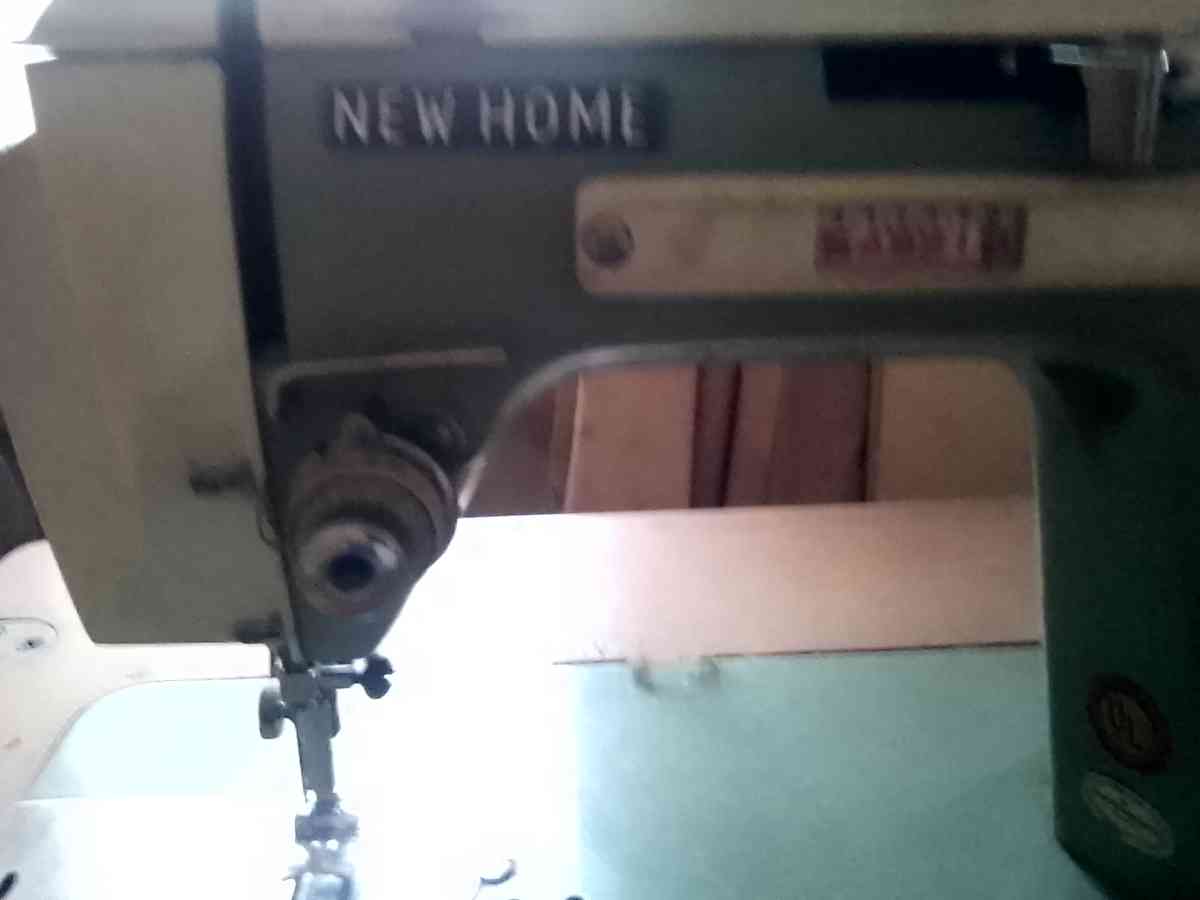 janome sewing machine in cabinet