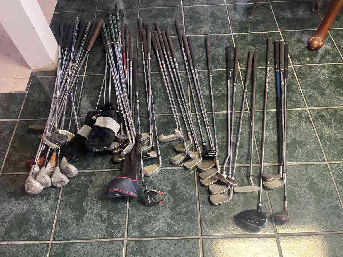 huge lot of golf clubs