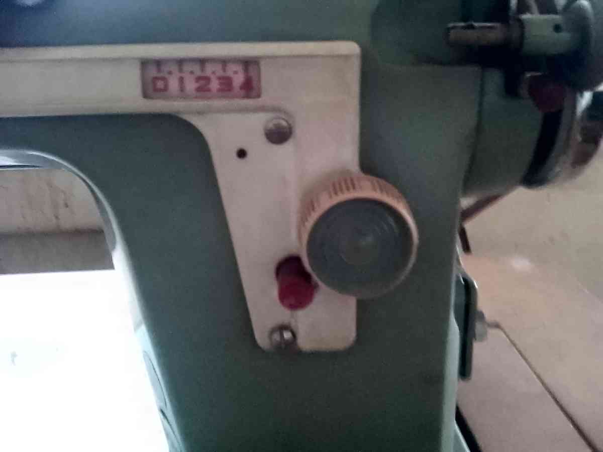 janome sewing machine in cabinet