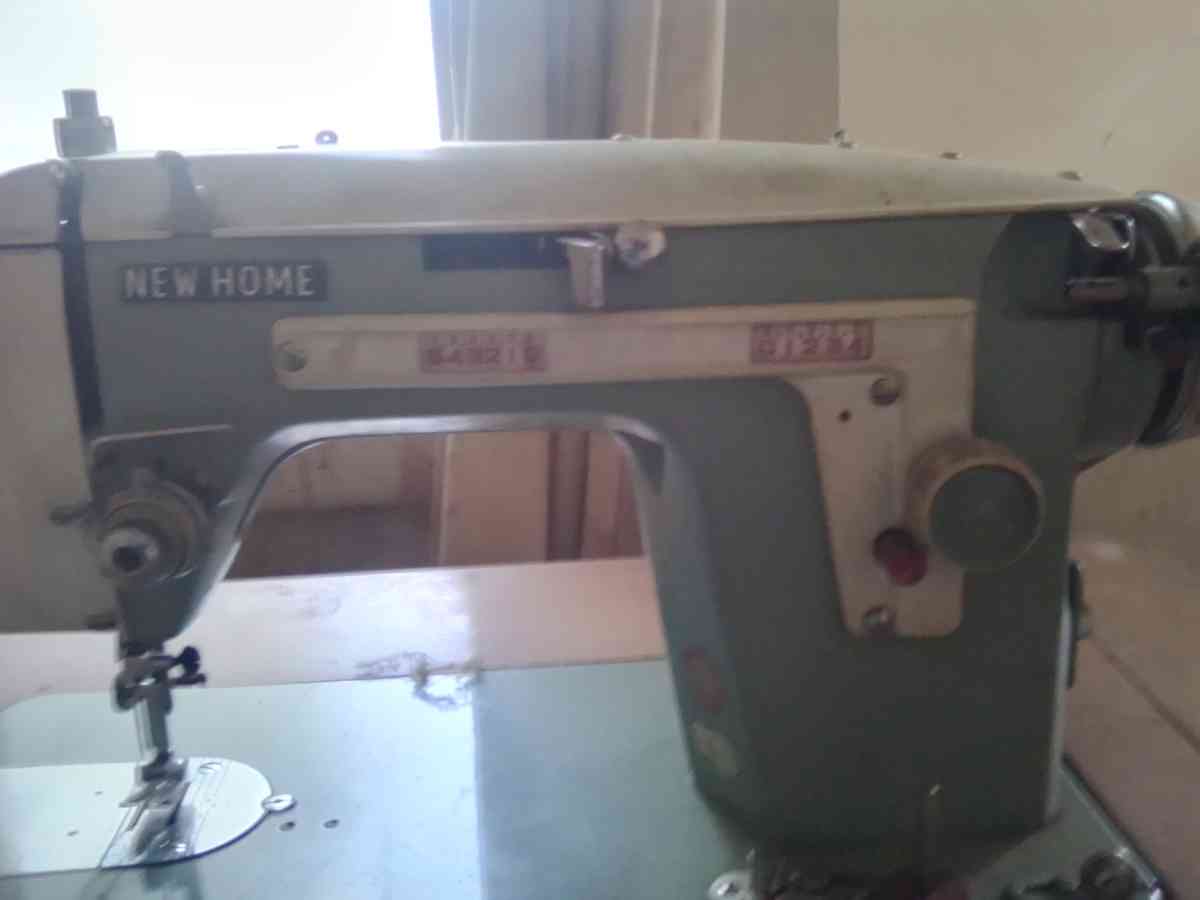 janome sewing machine in cabinet