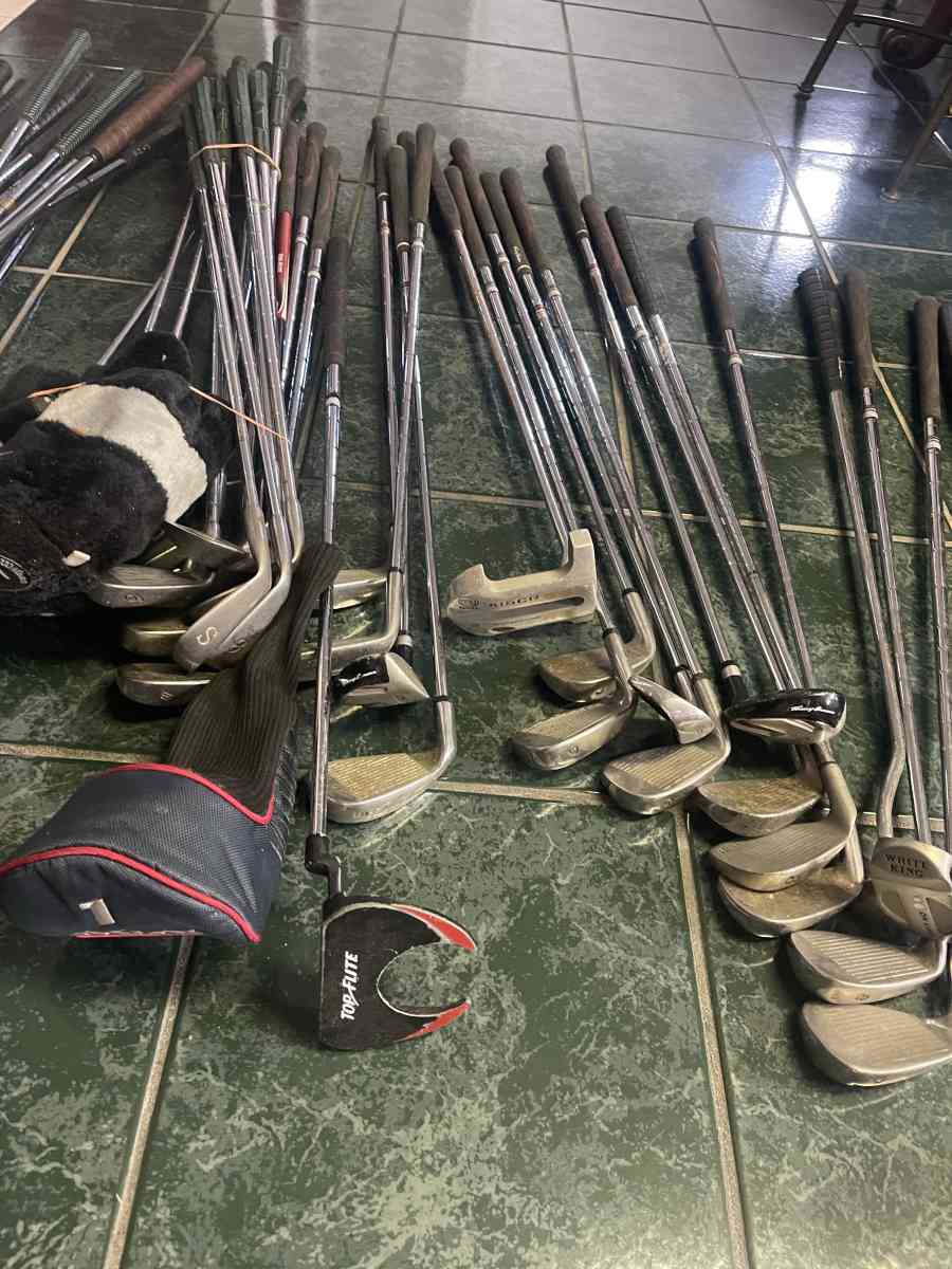 huge lot of golf clubs