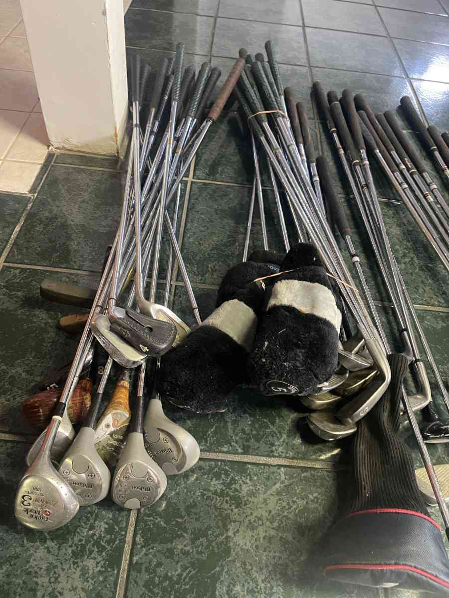 huge lot of golf clubs