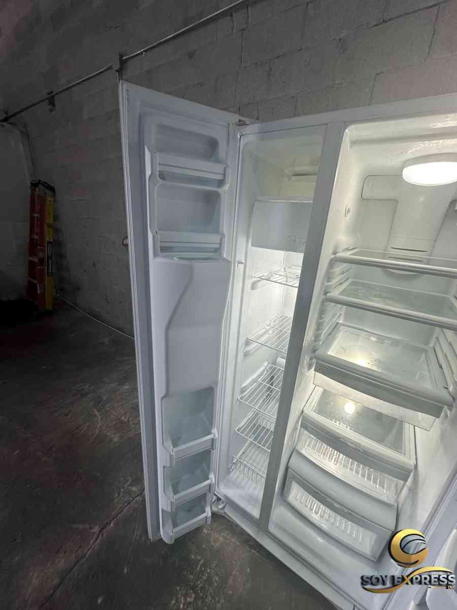 GE refrigerator side by side with ice and water dispenser