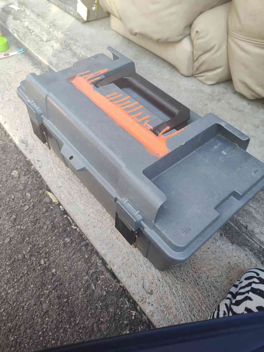 tool box with cleaning scrubbers and a drill