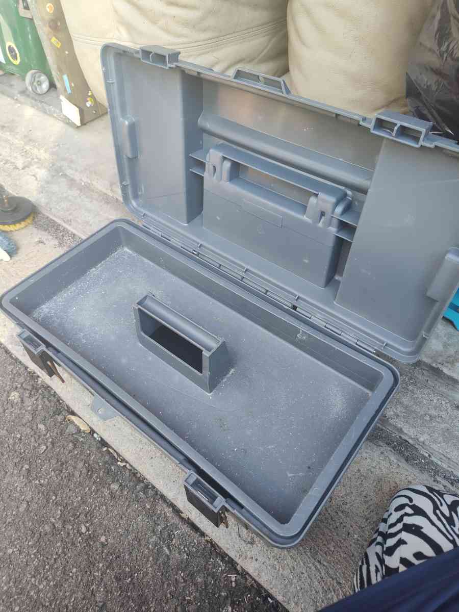 tool box with cleaning scrubbers and a drill