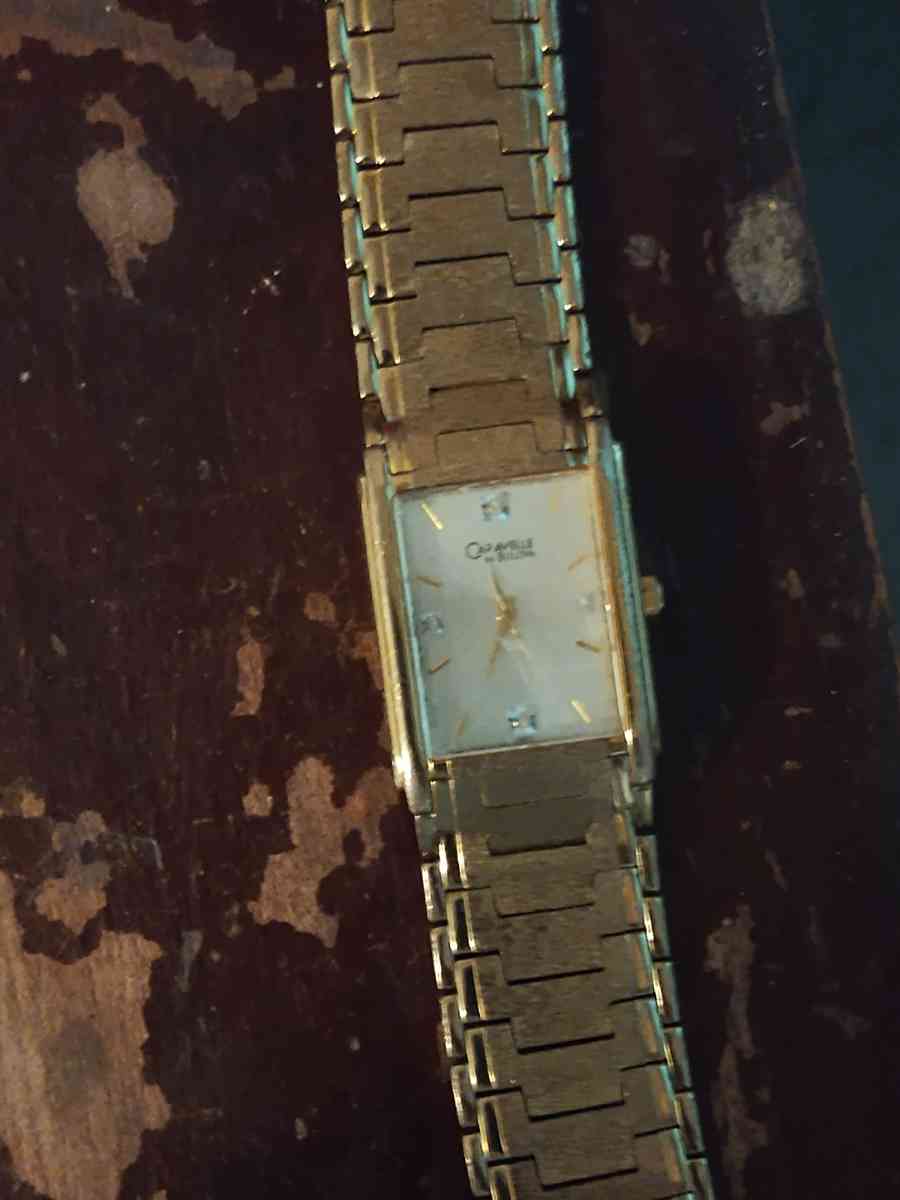 gold Bulova watch