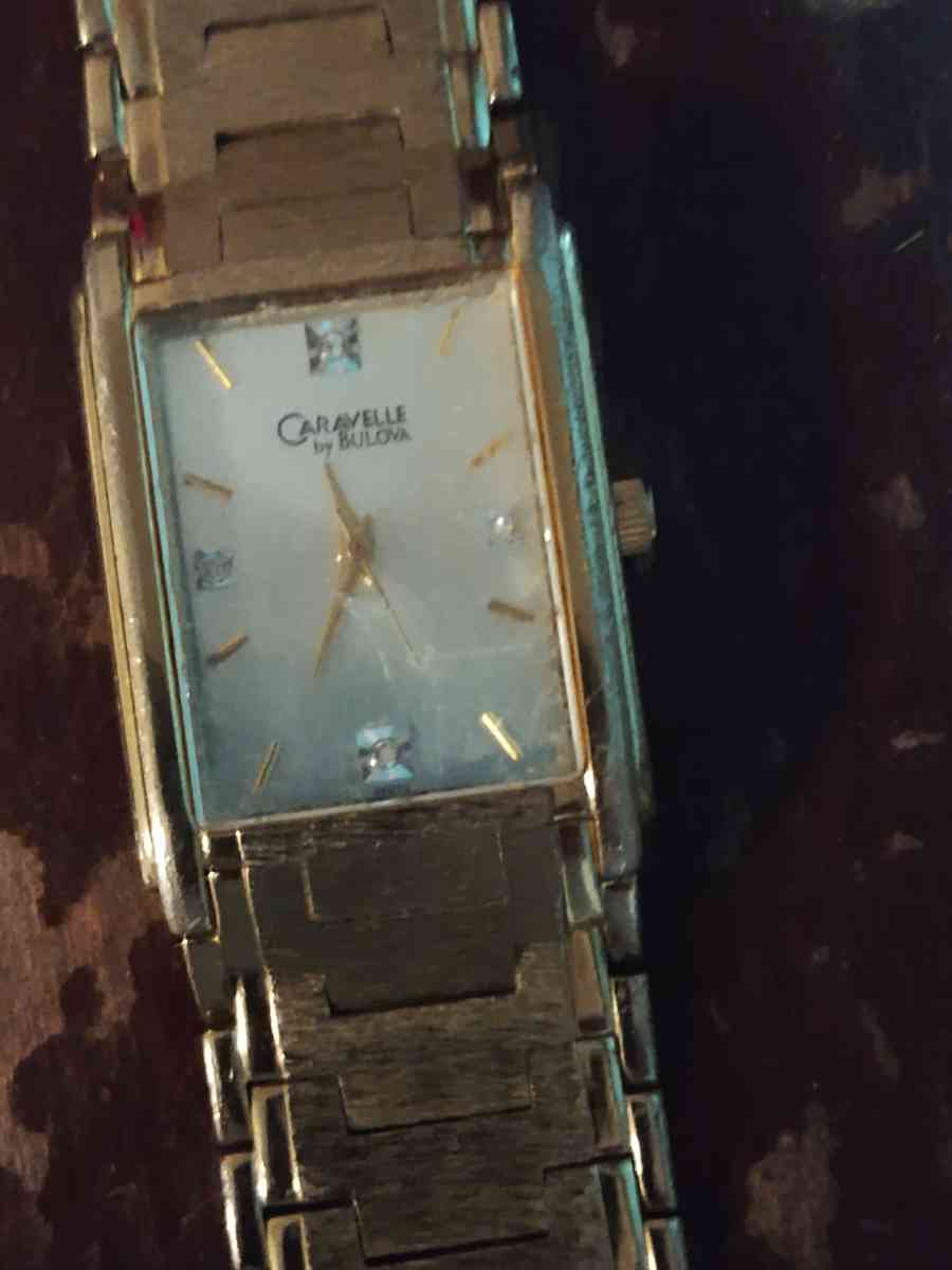 gold Bulova watch