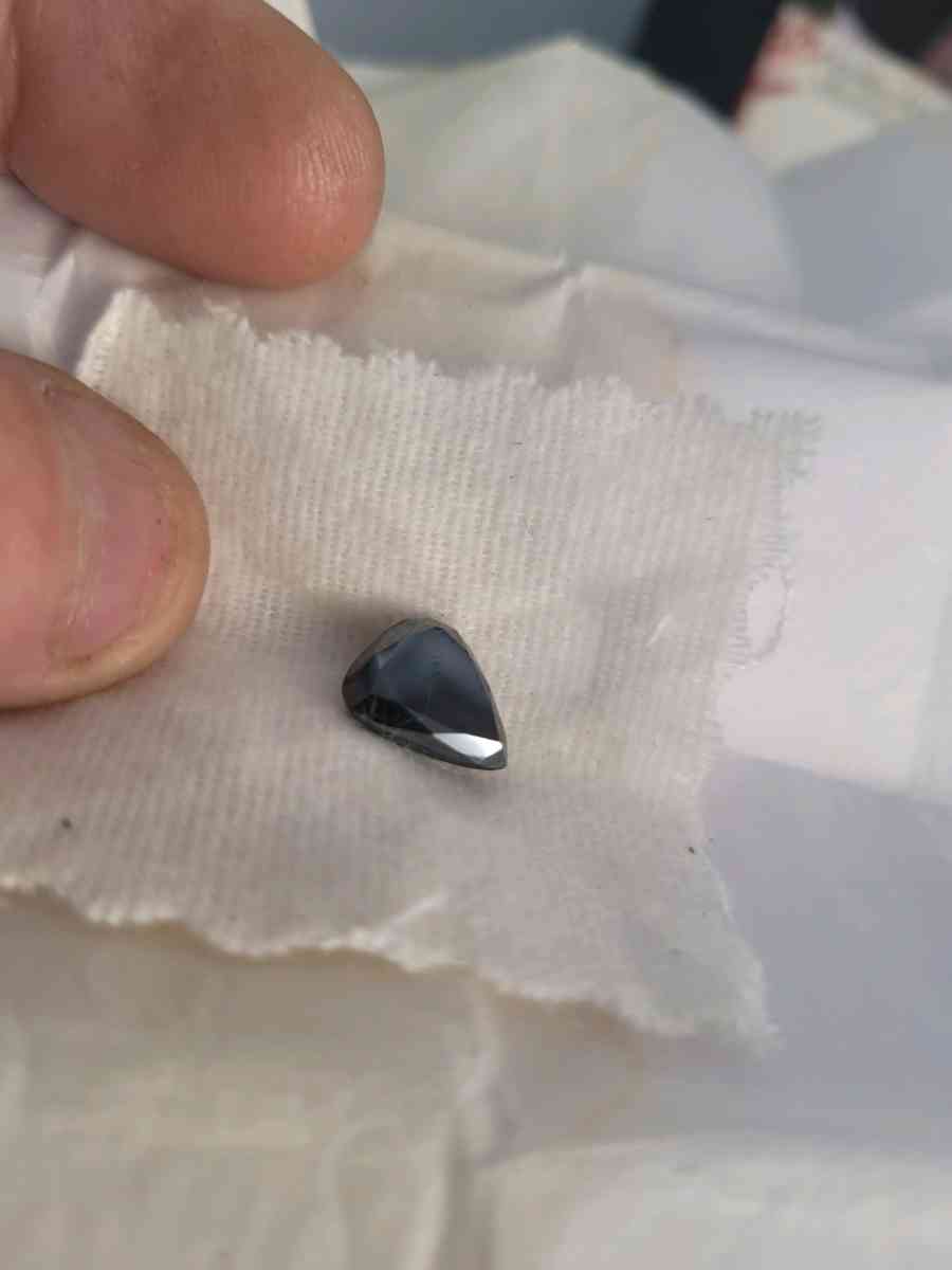 a nicely cut pearshaped black diamond