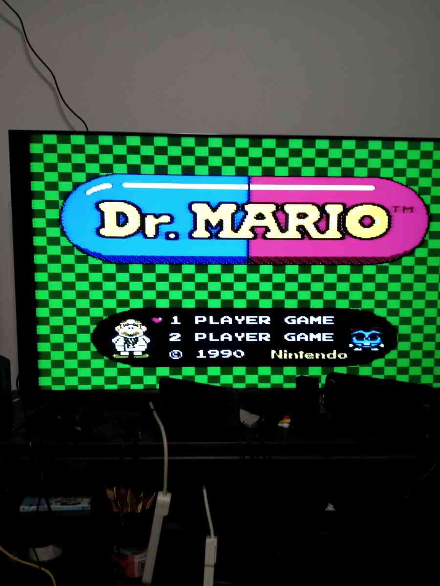 2 Nintendo NES consoles with 3 controllers and 5 games