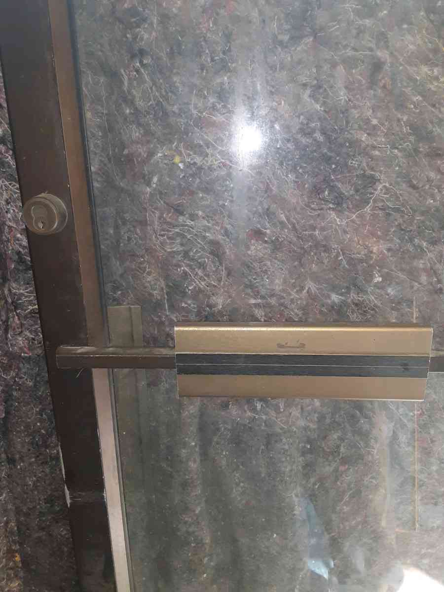 Commercial glass door with hinges but no frame