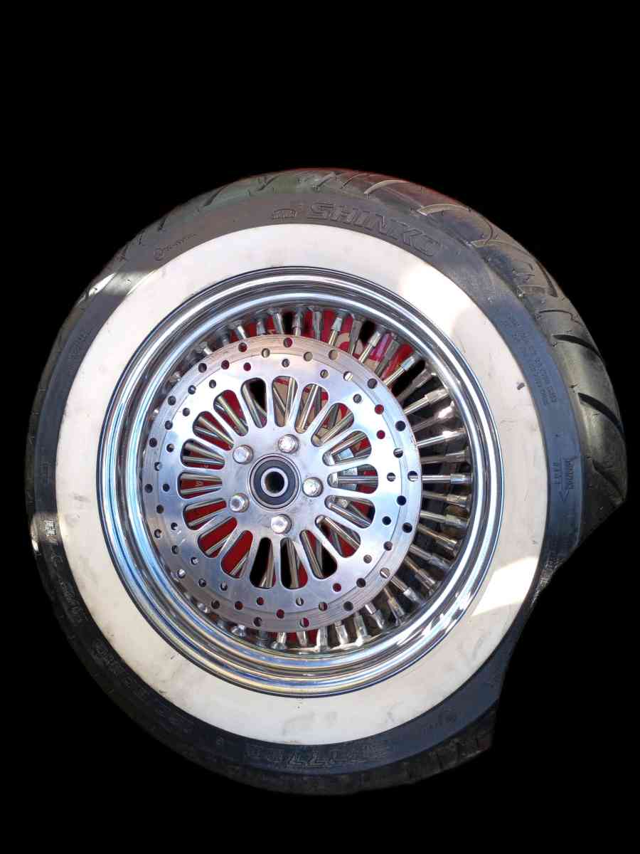 front and rear white wall tires and chrome spoke rims