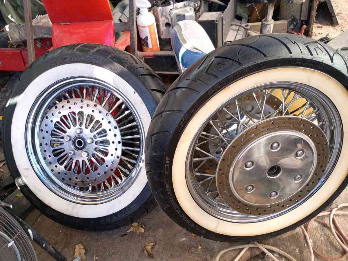 front and rear white wall tires and chrome spoke rims