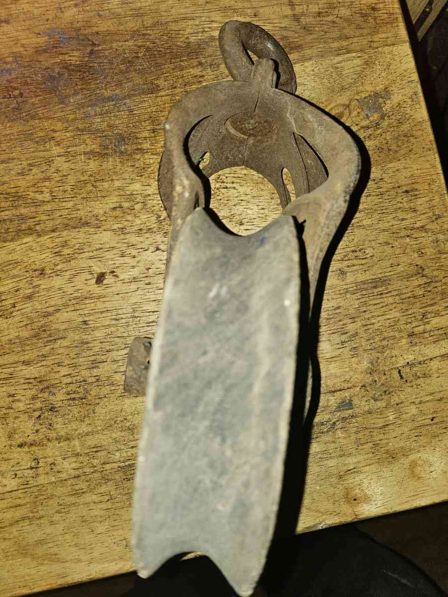 2 old wooden pulleys with metal frames 10 dollars for both