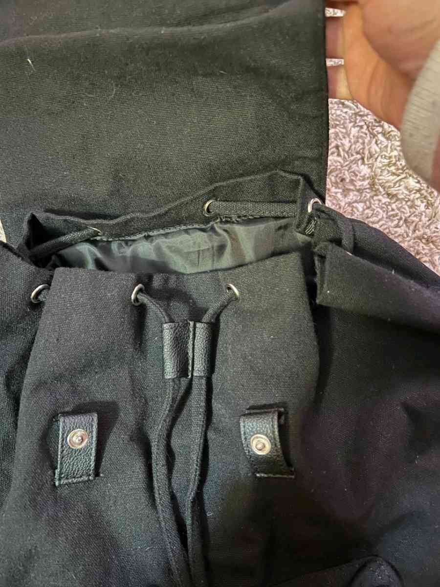 Trendy Black Canvas Backpack with Luxurious Leather Accents