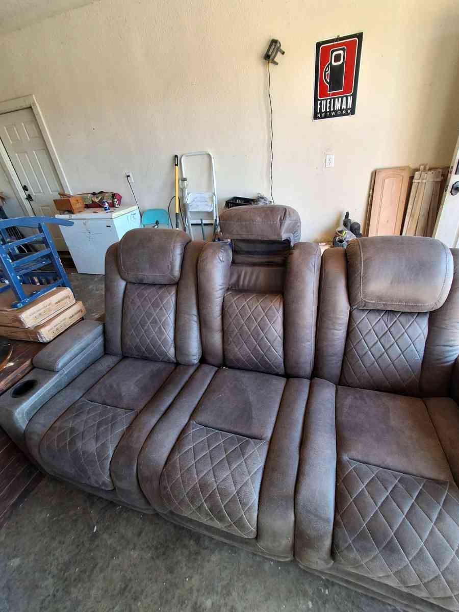 Brown suede couch the middle saint has a not lot in the midd