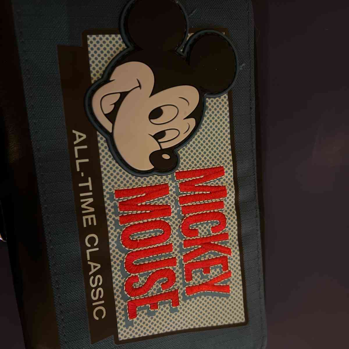 Mickey and Minnie Mouse clutches and a crossbody bag