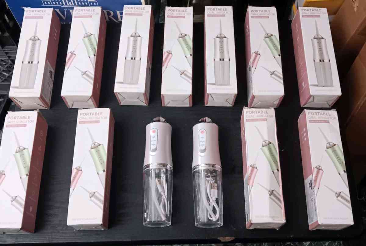 PORTABLE ORAL IRRIGITORS