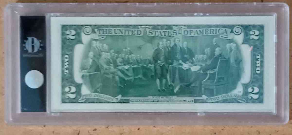 Colored yellow stone national park two dollar bill