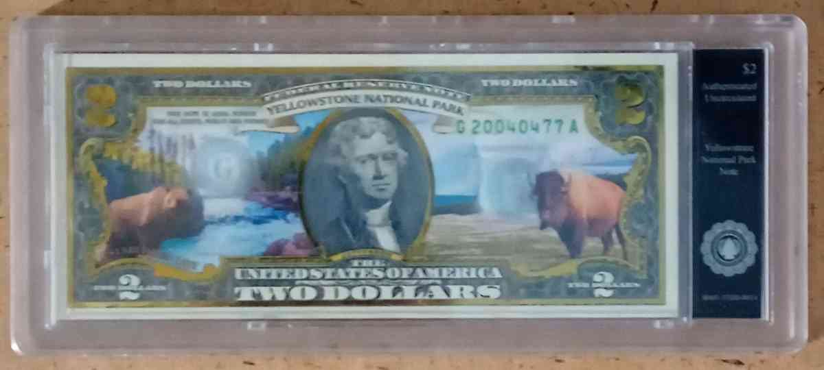 Colored yellow stone national park two dollar bill
