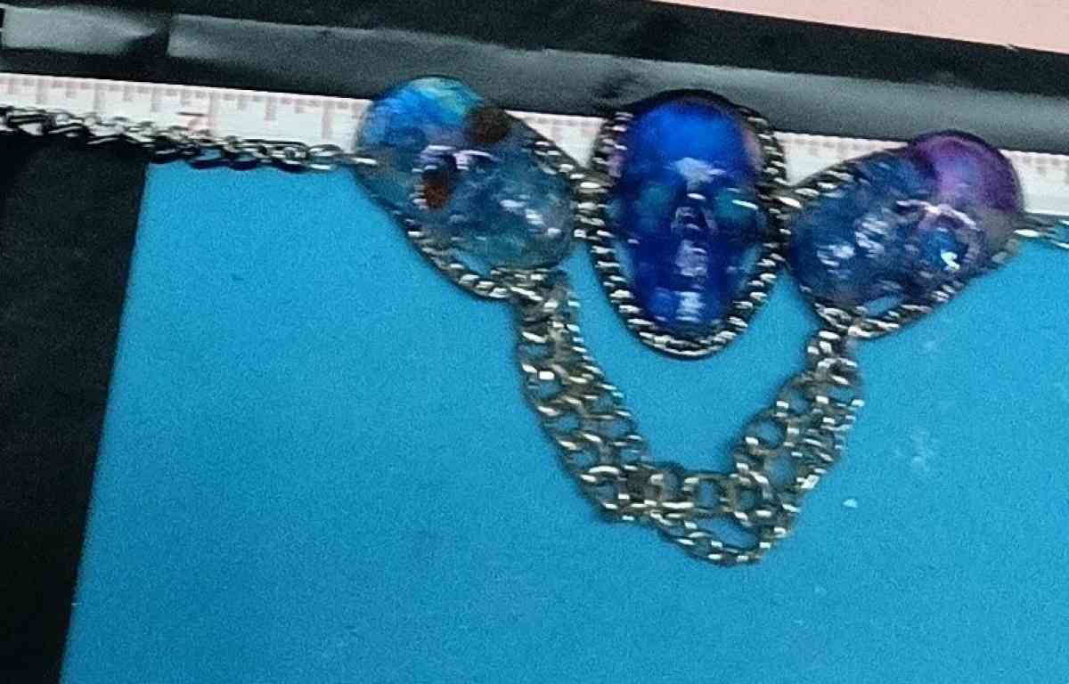 three skulls with multiple chains made with Uv resin