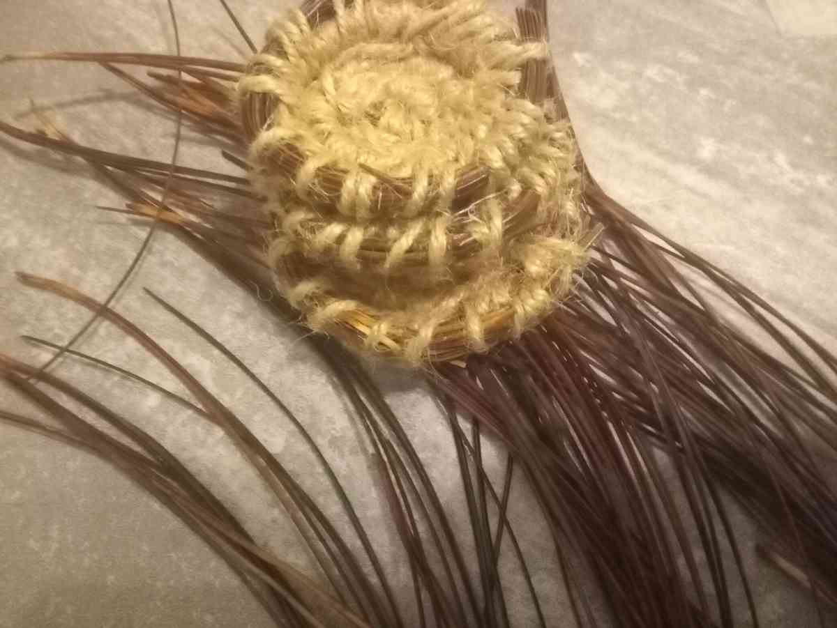 homemade jewelry order made out of pine needles and thread