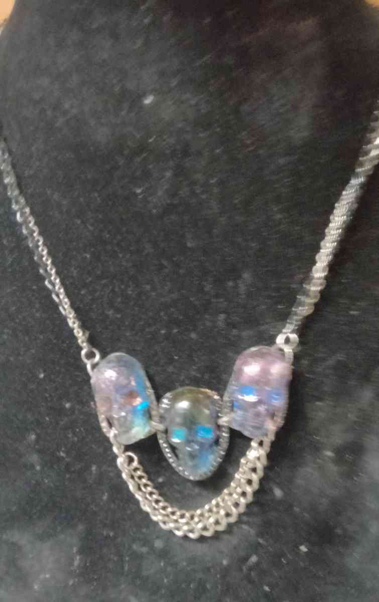 three skulls with multiple chains made with Uv resin